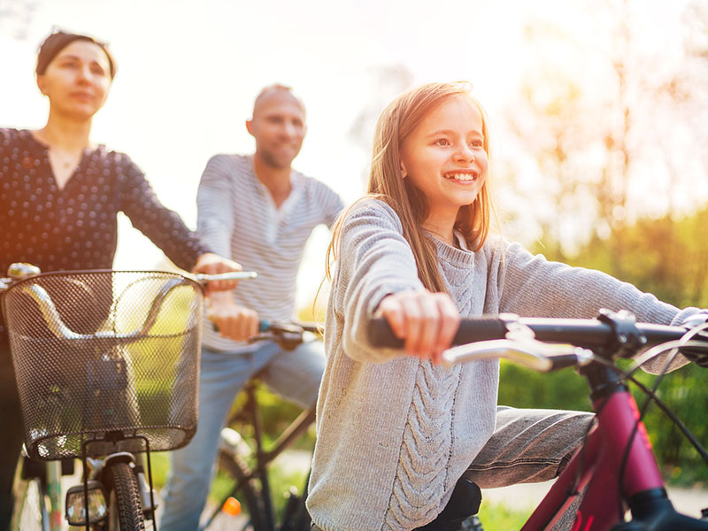 family riding bikes